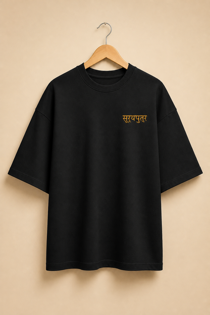 Suryaputra oversized tee in black – front chest wordmark on hanger