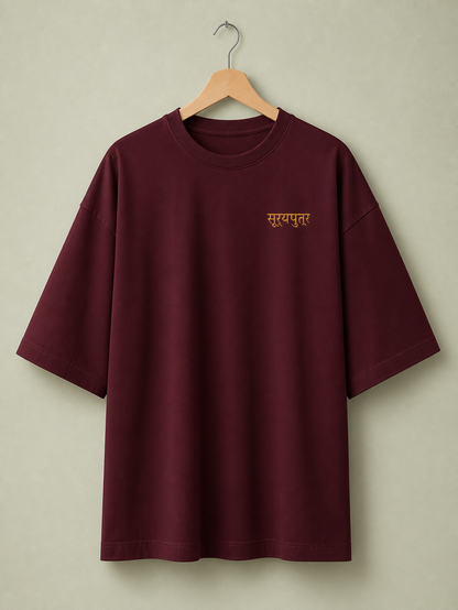 Suryaputra oversized tee in maroon – front chest wordmark on hanger