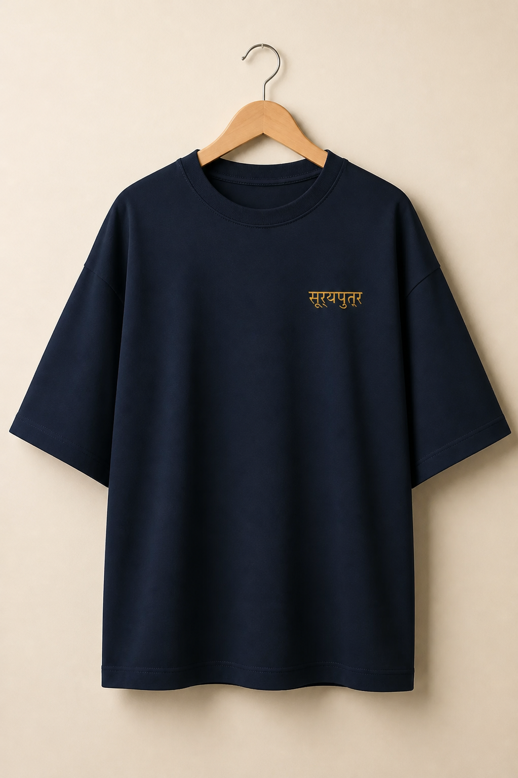 Suryaputra oversized tee in navy blue – front chest wordmark on hanger